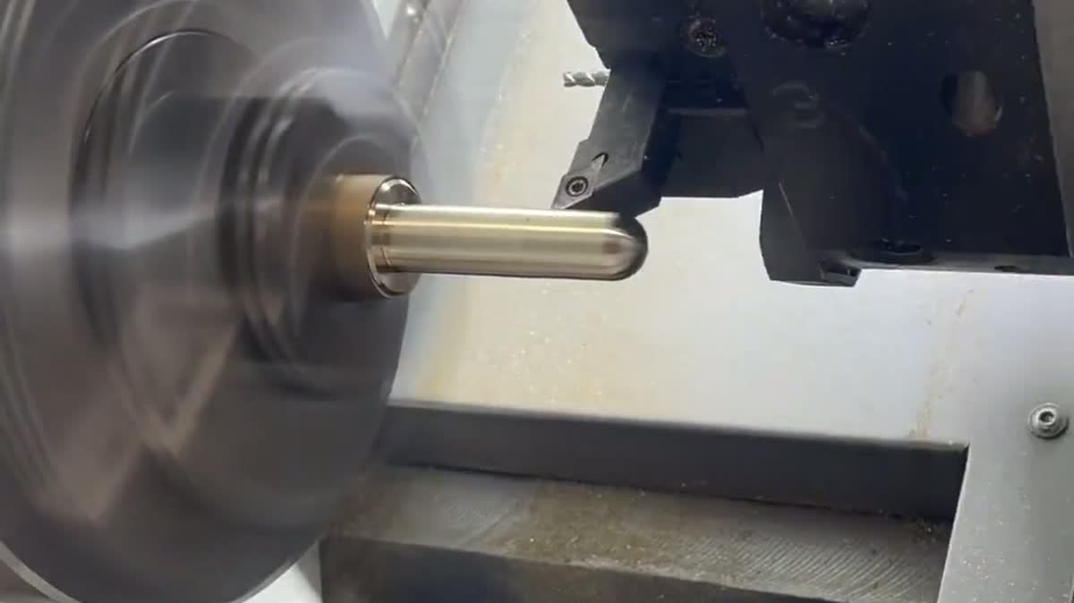 Spinning chuck turning a brass workpiece